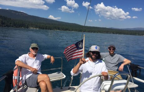 Jim Simon and Ravn Whitington with the Captain of Tahoe Cruz
